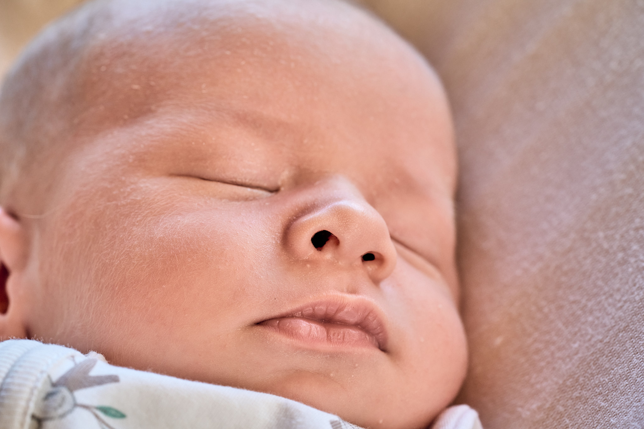 Close-up of a newborn baby sleeping peacefully, in-home newborn photography Melbourne