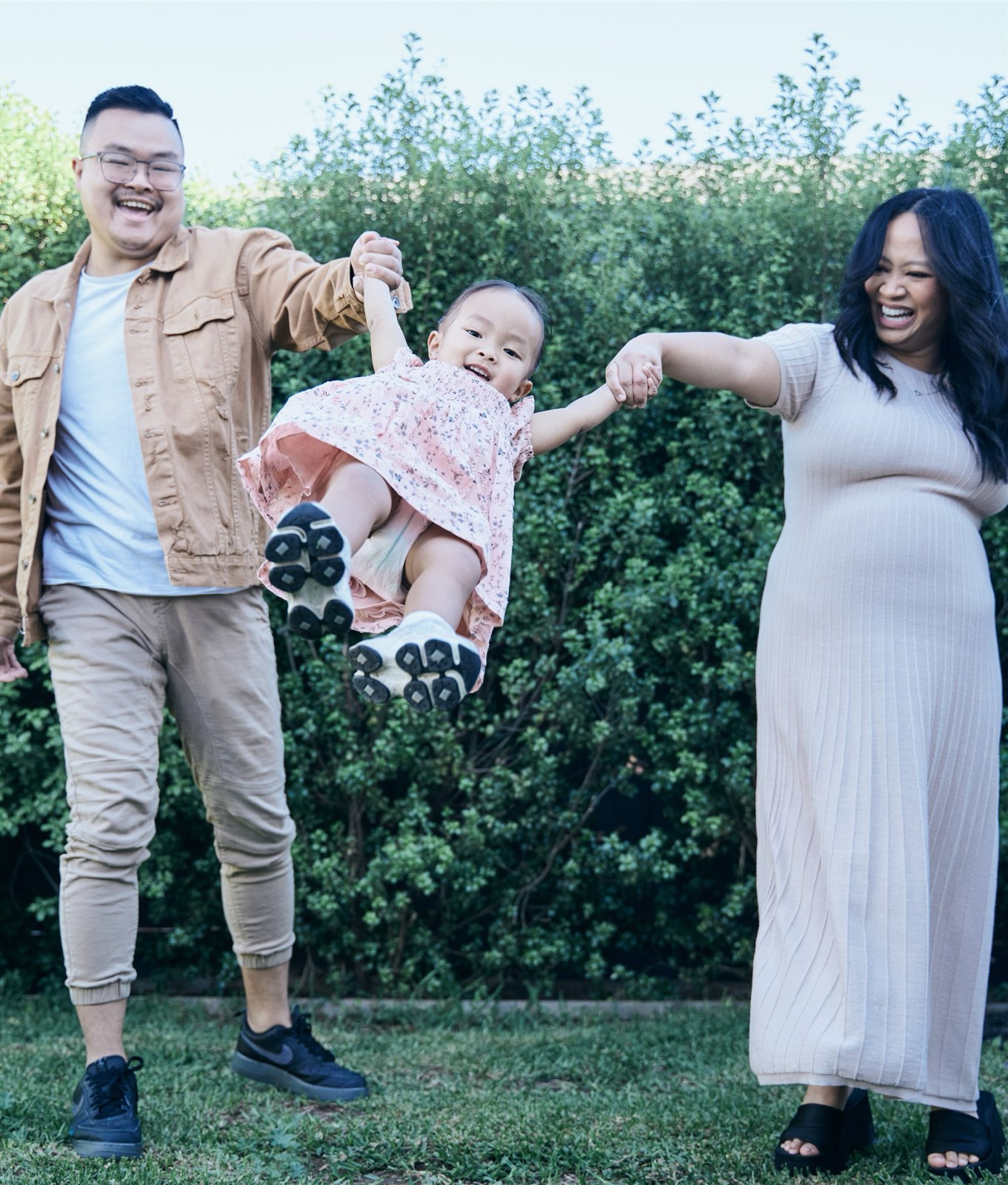 Expecting mum in a white dress with her toddler, outdoor maternity and family session