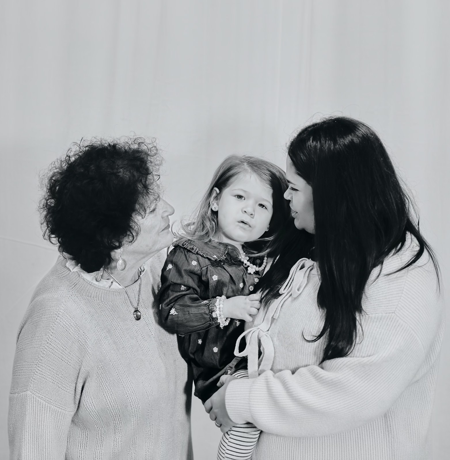 Black and white portrait of three generations of women together