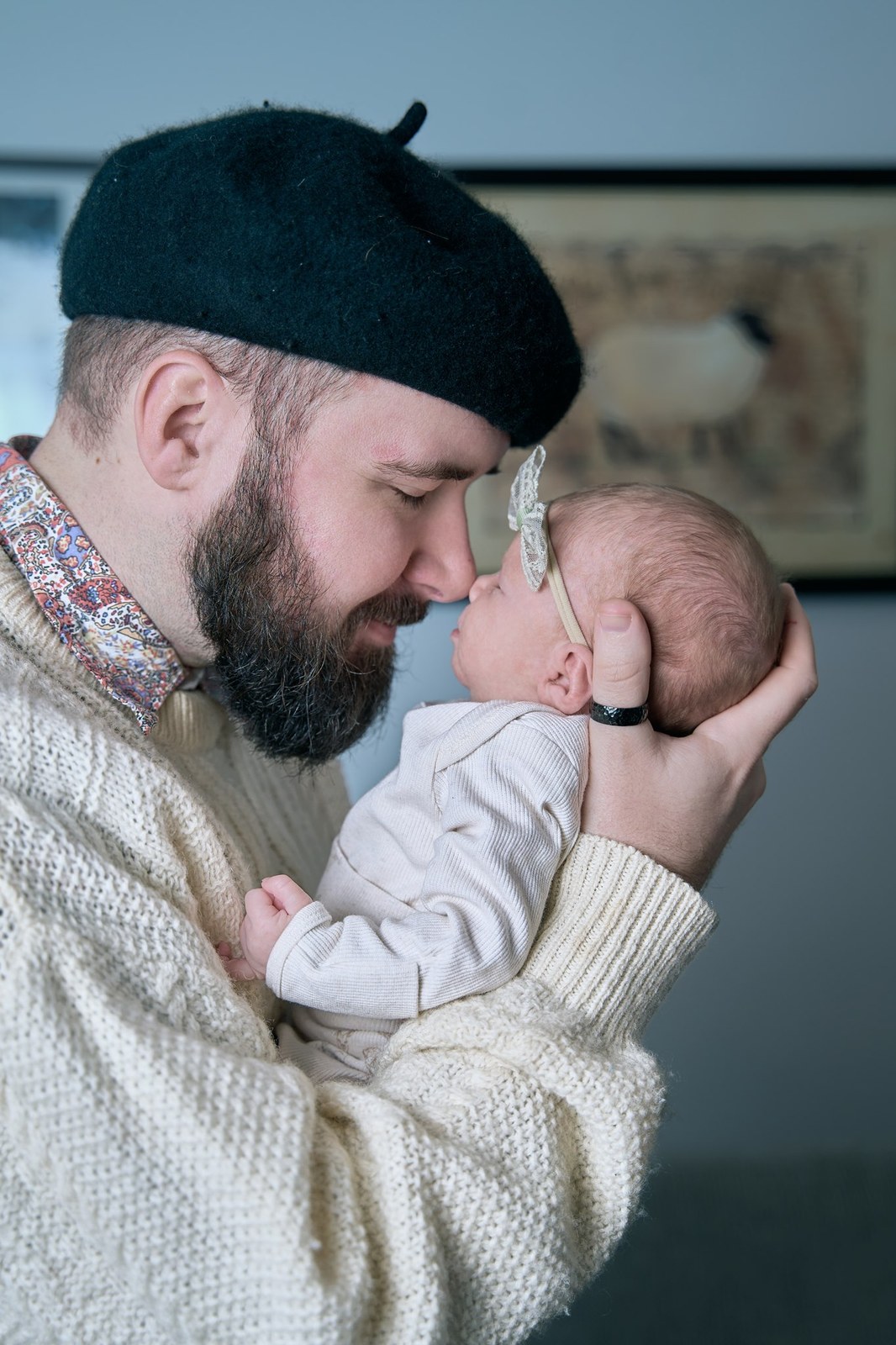 Dad nose to nose with his newborn daughter at home