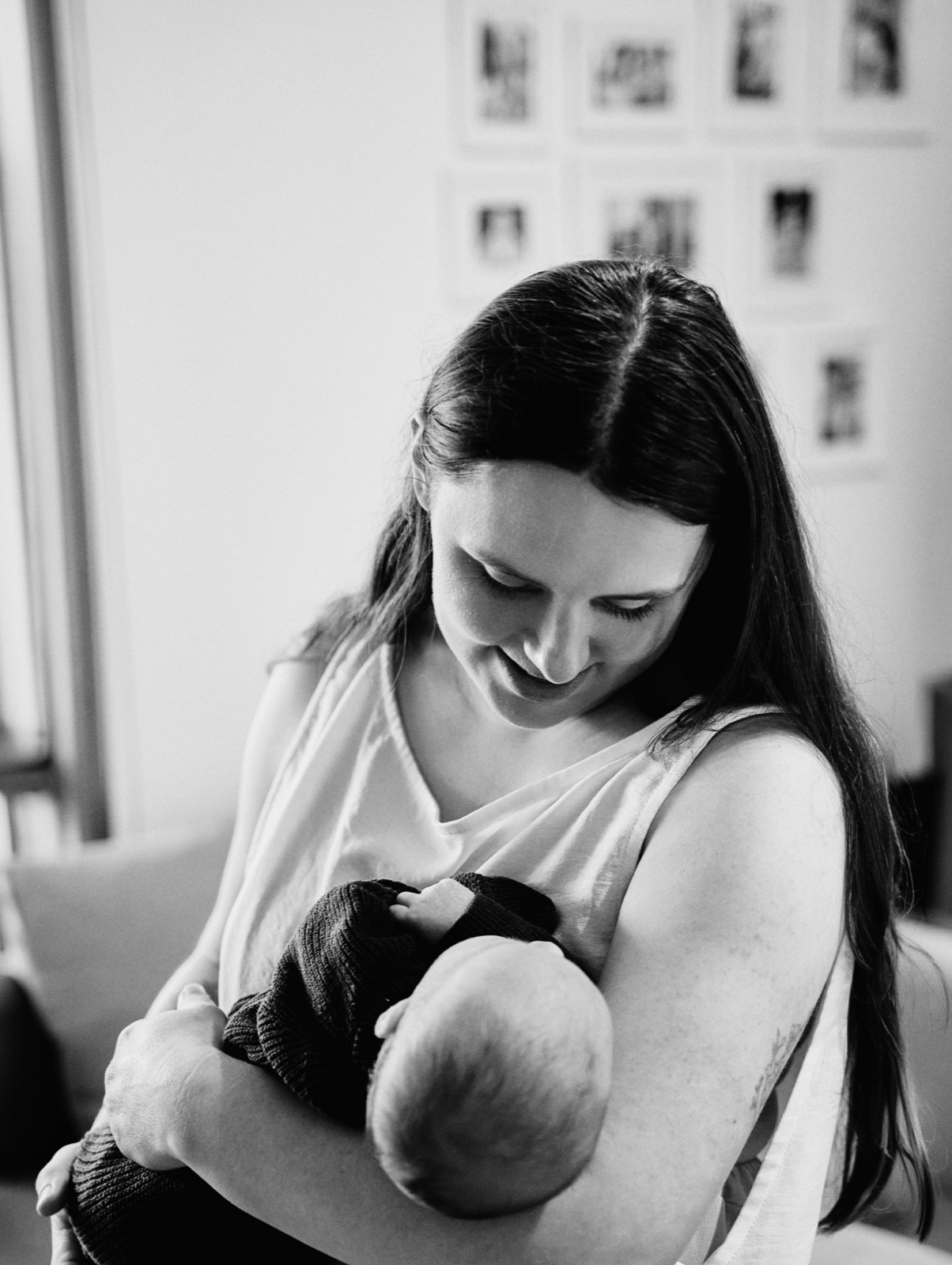 Black and white photo of mum nursing her baby