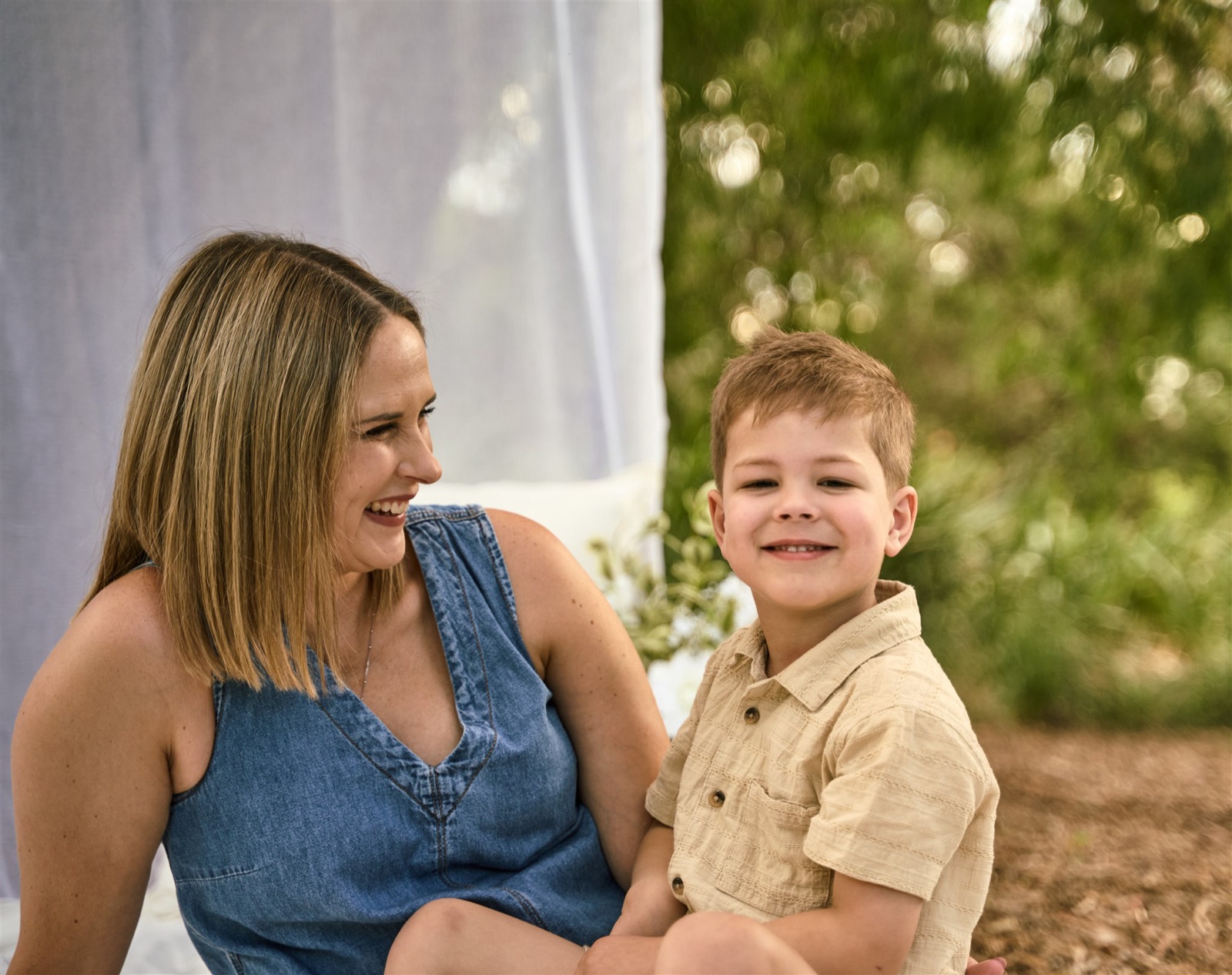 Mum with her toddler in the garden, casual outdoor motherhood session