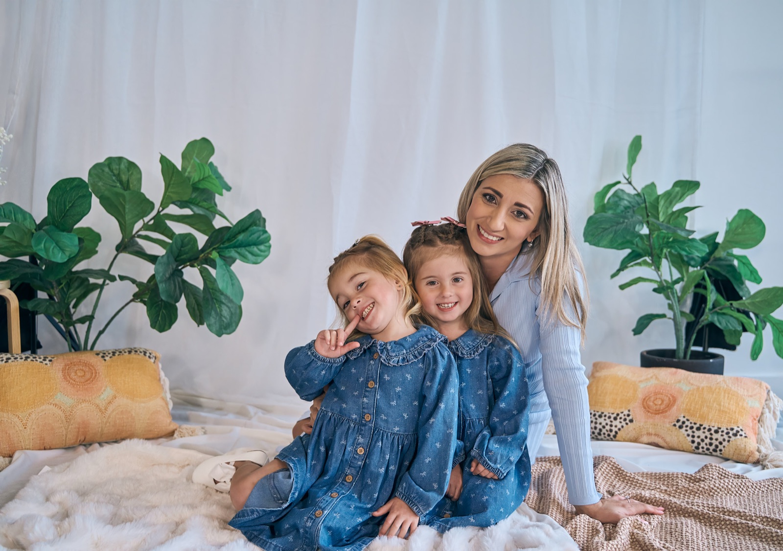 Mum and her daughters sharing a laugh during an in-home session, Cranbourne